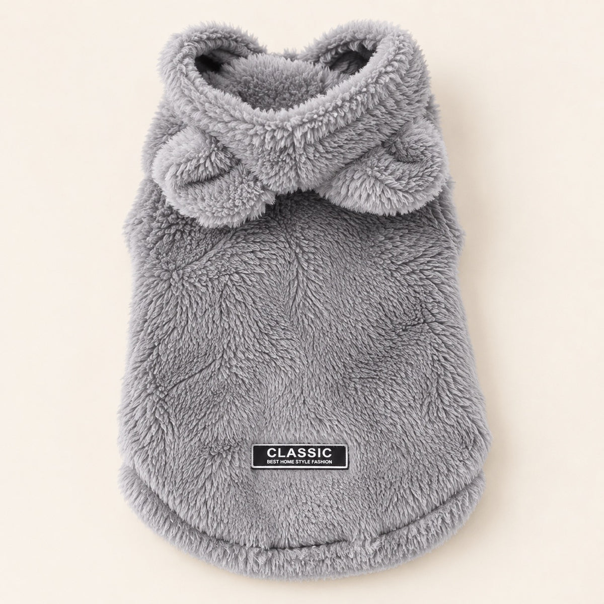 Grijze Teddyhoodie met capuchon op crème achtergrond